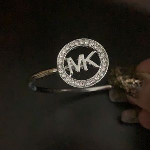 NWT silver and rhinestone designer emblem bracelet